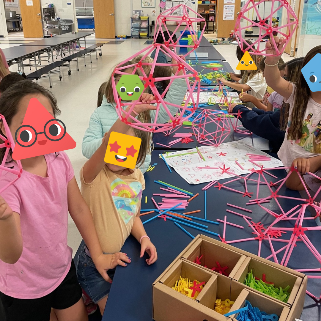 A group of students showing off their Strawbees builds.