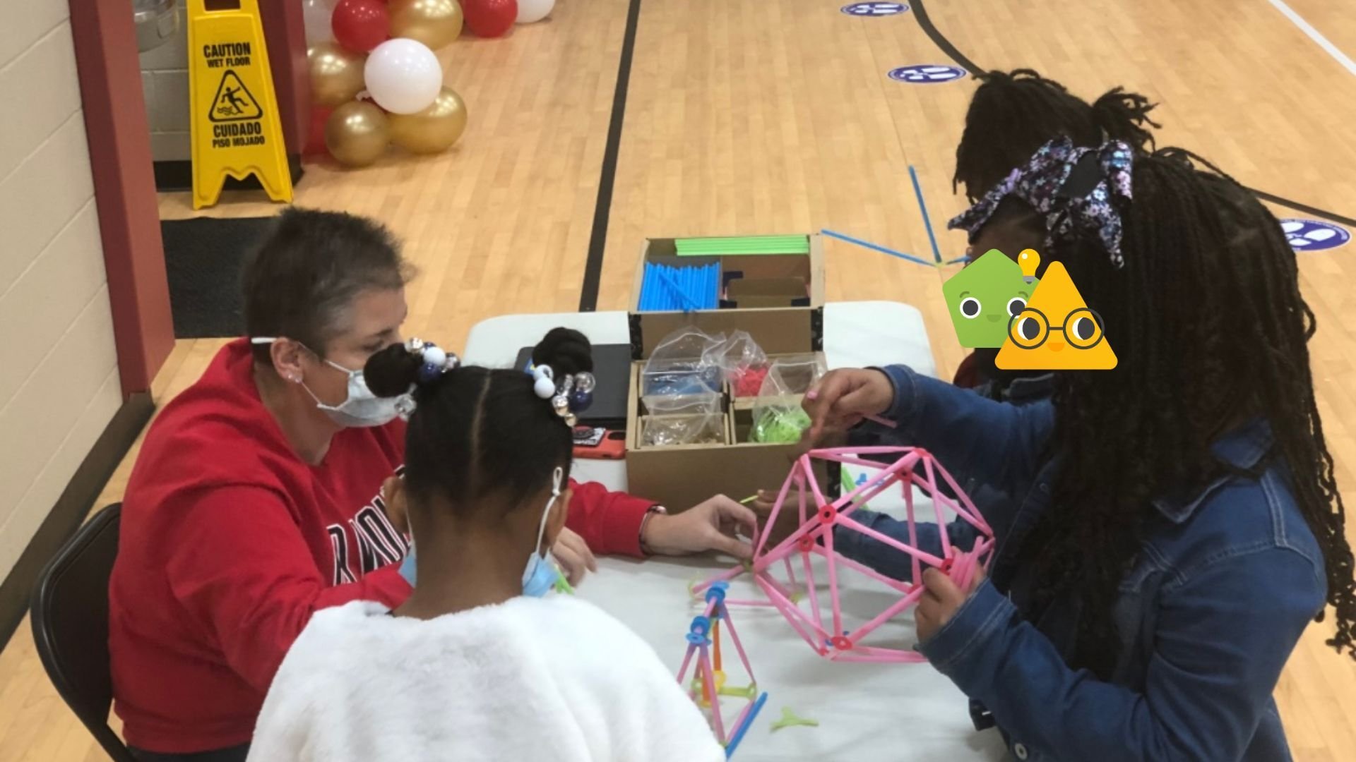 Sara working with a group of students.