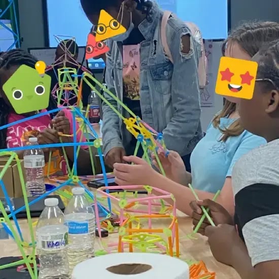 A group of students using Strawbees.